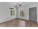 Inviting living room with tile floors, two large windows and a gray entry door at 2402 E 5Th St # 1621, Tempe, AZ 85288