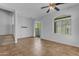 Open-concept living area with neutral paint, tile floors and a ceiling fan at 2402 E 5Th St # 1621, Tempe, AZ 85288