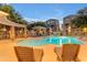 Relaxing community pool with lounge chairs and shaded seating area at dusk at 2402 E 5Th St # 1621, Tempe, AZ 85288