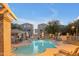 Inviting community pool with lounge chairs and shaded seating area at twilight at 2402 E 5Th St # 1621, Tempe, AZ 85288