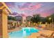 Inviting community pool with lounge chairs and shaded seating area at twilight at 2402 E 5Th St # 1621, Tempe, AZ 85288