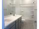 Bathroom featuring a double sink vanity and a tub-shower combination at 25151 W Wayland Dr, Buckeye, AZ 85326