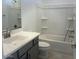 Bathroom featuring a single sink vanity and a tub-shower combination at 25151 W Wayland Dr, Buckeye, AZ 85326