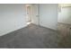 Cozy bedroom with neutral walls, carpet flooring, and walk-in closet at 25151 W Wayland Dr, Buckeye, AZ 85326
