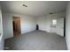 Bright, spacious bedroom featuring neutral walls, tile floors, and natural light from a large window at 25151 W Wayland Dr, Buckeye, AZ 85326