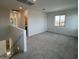Spacious bonus room area is carpeted with a large window offering natural light at 25151 W Wayland Dr, Buckeye, AZ 85326