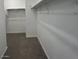 Walk-in closet with shelving and ample space for storage, providing organization at 25151 W Wayland Dr, Buckeye, AZ 85326