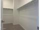 Walk-in closet with built-in shelving and ample storage space at 25151 W Wayland Dr, Buckeye, AZ 85326