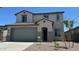 Charming two-story home featuring a neutral color palette and a convenient two-car garage at 25151 W Wayland Dr, Buckeye, AZ 85326