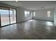 Open living room with large windows and sliding glass doors allowing natural light at 25151 W Wayland Dr, Buckeye, AZ 85326