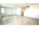 Spacious living room with neutral tile flooring and bright natural light from multiple windows at 25151 W Wayland Dr, Buckeye, AZ 85326