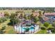 A beautiful community pool is surrounded by lush landscaping and palm trees at 30 E Brown Rd # 1048, Mesa, AZ 85201