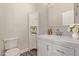 Bathroom featuring new vanity, faucet, mirror, and cabinet for ample storage at 3437 E Kingbird Pl, Chandler, AZ 85286