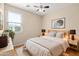 Serene bedroom features hardwood floors, soft lighting, and a cozy rug at 3437 E Kingbird Pl, Chandler, AZ 85286