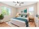 Well-lit bedroom featuring neutral walls, a ceiling fan, and coordinated decor at 3437 E Kingbird Pl, Chandler, AZ 85286
