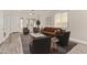 An open-concept living room featuring hardwood flooring, a sofa set and natural light at 3437 E Kingbird Pl, Chandler, AZ 85286