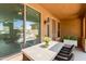 Covered patio with a table, chairs, and sliding glass doors that provide natural light and backyard views at 3437 E Kingbird Pl, Chandler, AZ 85286