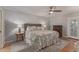 Comfortable bedroom features a ceiling fan, lamps and dresser at 5008 E Nisbet Rd, Scottsdale, AZ 85254