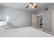 Simple bedroom with gray walls, white trim, and a partial view of a white metal bed at 5008 E Nisbet Rd, Scottsdale, AZ 85254