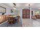 Bright dining room featuring a wooden table, natural light, and tile flooring at 5008 E Nisbet Rd, Scottsdale, AZ 85254