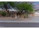 Inviting single-story home featuring desert landscaping, a two-car garage, and neutral paint at 5008 E Nisbet Rd, Scottsdale, AZ 85254