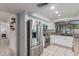 Bright kitchen with stainless steel appliances, granite countertops, and white cabinetry at 5008 E Nisbet Rd, Scottsdale, AZ 85254