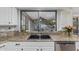 Kitchen sink with granite countertops and a view to the pool at 5008 E Nisbet Rd, Scottsdale, AZ 85254