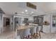 Well-lit kitchen featuring stainless appliances, granite countertops, and an island with bar seating at 5008 E Nisbet Rd, Scottsdale, AZ 85254