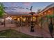 Inviting covered patio with dining area, ceiling fans and a cozy seating area for outdoor enjoyment at 5008 E Nisbet Rd, Scottsdale, AZ 85254