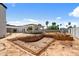 Backyard under construction with in-ground pool and new home construction at 6202 E Larkspur Dr, Scottsdale, AZ 85254