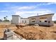 Backyard under construction with in-ground pool and new home construction at 6202 E Larkspur Dr, Scottsdale, AZ 85254