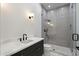 Modern bathroom featuring a walk-in shower with gray vertical tiling and black matte hardware at 6202 E Larkspur Dr, Scottsdale, AZ 85254