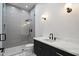 Modern bathroom featuring a walk-in shower with gray vertical tiling and black matte hardware at 6202 E Larkspur Dr, Scottsdale, AZ 85254