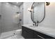 Modern bathroom features dark vanity, marble countertop, and glass enclosed shower at 6202 E Larkspur Dr, Scottsdale, AZ 85254