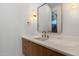 Bathroom sink with marble countertop, gold faucet and fixtures, wood vanity at 6202 E Larkspur Dr, Scottsdale, AZ 85254