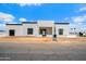 Modern home with white stone accents, black trim, and minimalist design at 6202 E Larkspur Dr, Scottsdale, AZ 85254
