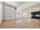 Spacious three-car garage featuring epoxy flooring and custom storage cabinets at 6202 E Larkspur Dr, Scottsdale, AZ 85254