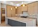 Gourmet kitchen with marble counters, custom cabinets, and stainless steel appliances at 6202 E Larkspur Dr, Scottsdale, AZ 85254