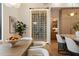Kitchen featuring a wine rack, modern appliances, a dining area, and natural wood finishes at 6202 E Larkspur Dr, Scottsdale, AZ 85254