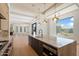 Open kitchen with island, marble countertops, and modern appliances in a spacious layout at 6202 E Larkspur Dr, Scottsdale, AZ 85254
