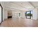Expansive living room with lots of natural light and hardwood floors and bar at 6202 E Larkspur Dr, Scottsdale, AZ 85254
