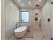 Modern bathroom featuring a soaking tub, walk-in shower, elegant fixtures, and decorative tile work at 6202 E Larkspur Dr, Scottsdale, AZ 85254
