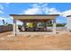 Outdoor kitchen featuring a pizza oven and fireplace at 6202 E Larkspur Dr, Scottsdale, AZ 85254