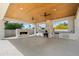 Outdoor kitchen featuring a pizza oven and fireplace at 6202 E Larkspur Dr, Scottsdale, AZ 85254
