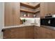 Well-organized pantry with custom cabinetry, open shelving, and premium appliances at 6202 E Larkspur Dr, Scottsdale, AZ 85254