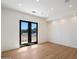 Bright, open room with recessed lighting and sliding glass doors overlooking a front yard at 6202 E Larkspur Dr, Scottsdale, AZ 85254