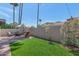 Charming backyard with green grass, a brick patio, outdoor seating, and mature landscaping at 7917 E Cactus Wren Rd, Scottsdale, AZ 85250