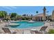 Relaxing community pool area with ample seating, shaded structures, and mature landscaping at 7917 E Cactus Wren Rd, Scottsdale, AZ 85250