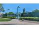 Well-maintained tennis courts with green fencing, surrounded by lush landscaping and lighting at 7917 E Cactus Wren Rd, Scottsdale, AZ 85250