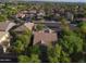 Aerial view of a residential neighborhood with mature trees at 865 E Rojo Ct, Gilbert, AZ 85297